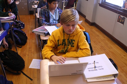 Charlie Waechter uses a Chromebook in Language Arts class