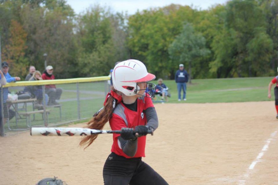 Nicole+Sharp+bats+during+a+softball+game+for+her+club+team.%0A