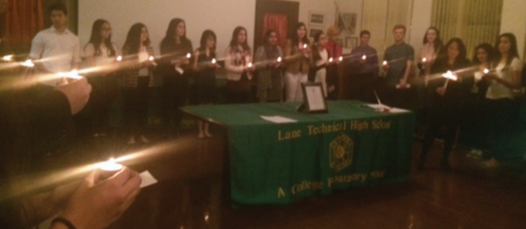 Distinguished Spanish students gather in room 113 for their induction into the Spanish National Honor Society. The AATSP recognizes students with extensive study in the subject, as well as  GPAs over 3.5 Along with the students, sponsors Dr. Daly, Ms. Esguerra, and Ms. Perez light candles to commemorate the students’ achievements in Spanish literature courses.