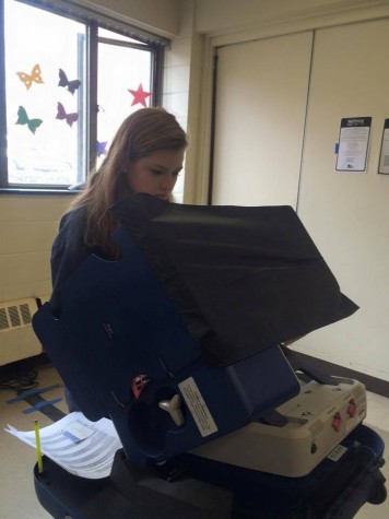 Bachrach is shown above voting for the presidential election  primary at her local polling place. 