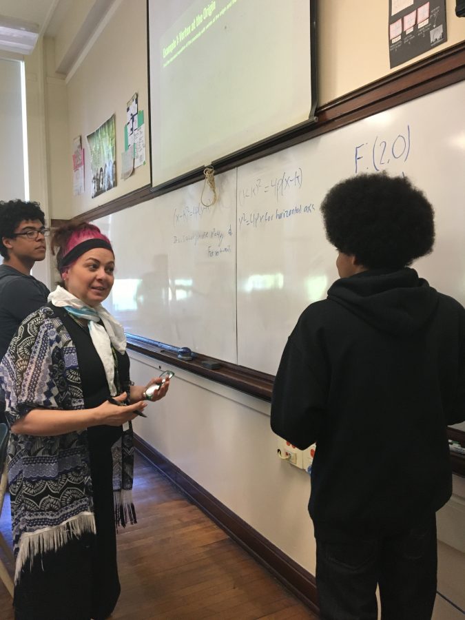 Padilla gives an in-depth explanation of a new topic in her Pre-Calculus class to Zach Holloway and Kyle Millderdavila.
