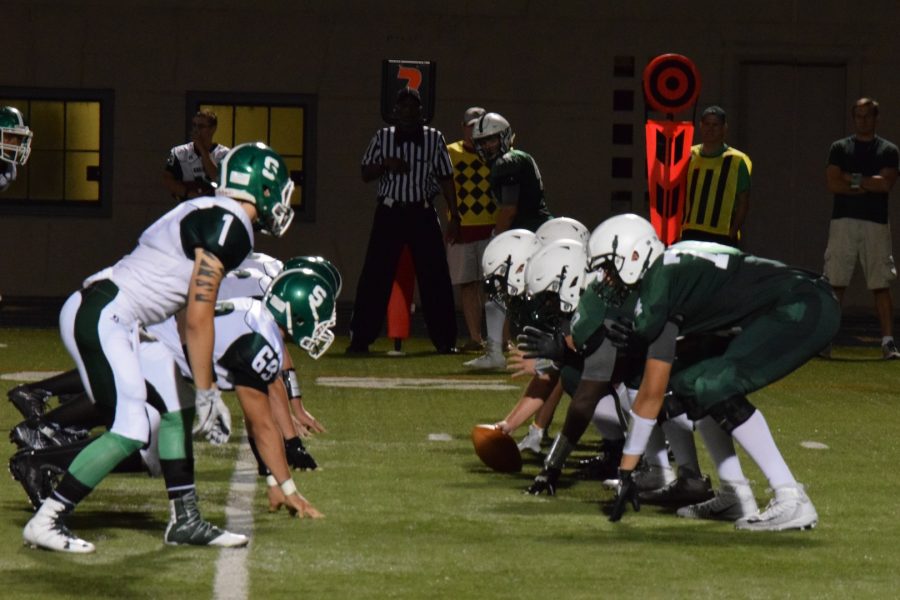 Lanes offense attempts to advance the ball in an Aug. 26 game against Oak Lawn. Lane lost the game 20-14. 
