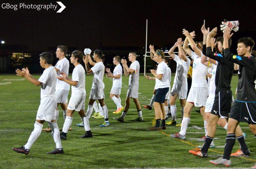 Lanes+soccer+team+applauding+towards+the+crowd+after+beating+Niles+West.%0A