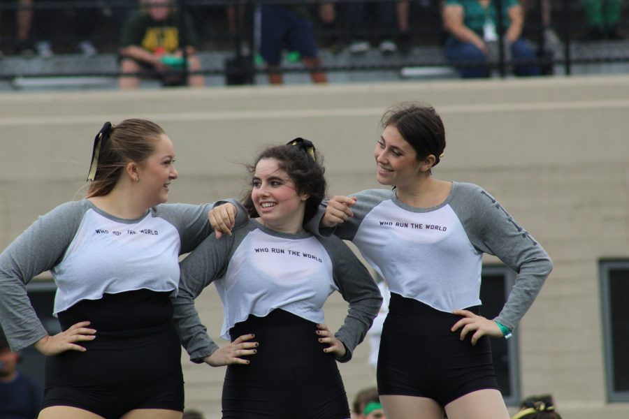 Captains of Lane Dance Team Emily Welch, left, Lily Lieser and Morgan Alexander gaze proudly into each others eyes after their last pep rally performance.