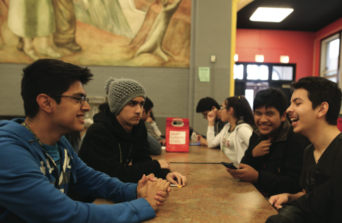 Aidan Martinez, Manuel Flores, Brian Malconado, Oscar Trapaga, Christian Aceves, and Angel Ruiz socialize during lunch in the cafeteria. They make it look easy, but some students struggle to find
a friendly face to eat with. (Note: This group did not use the “Sit with us” app.)