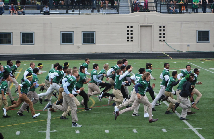 Lanes Varsity Football team storms the field during the Pep Rally. 
