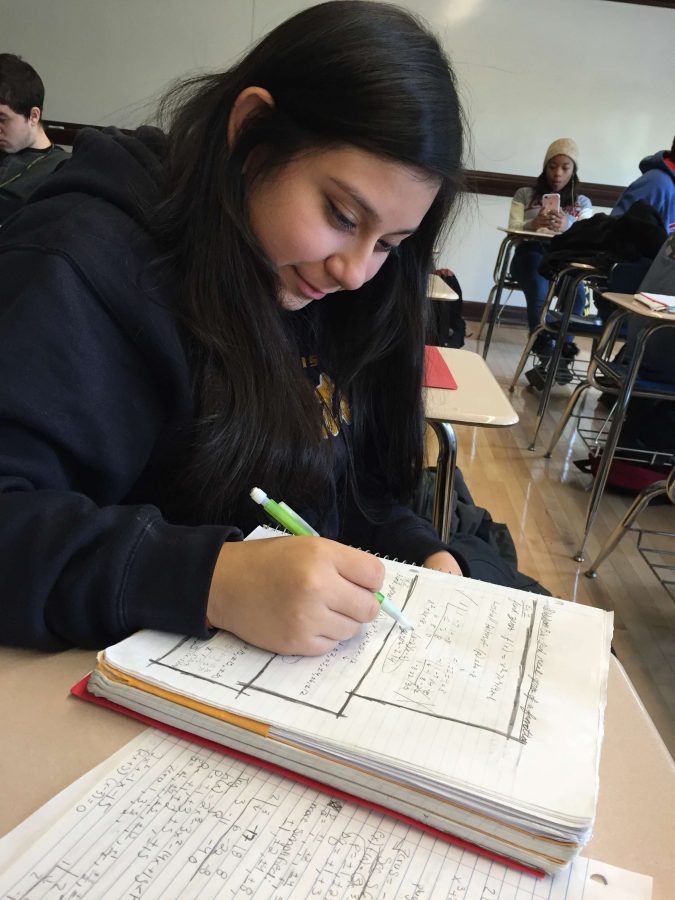 Crystal Salgado, Div. 986, works on a 
polynomial problem in preparation for 
the SAT, which will be given April 5.