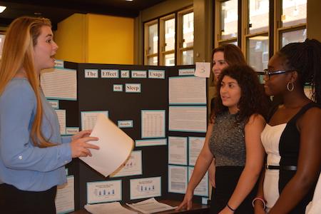 Kayla Dutton, Div. 977 presenting her science fair project to fellow students.  