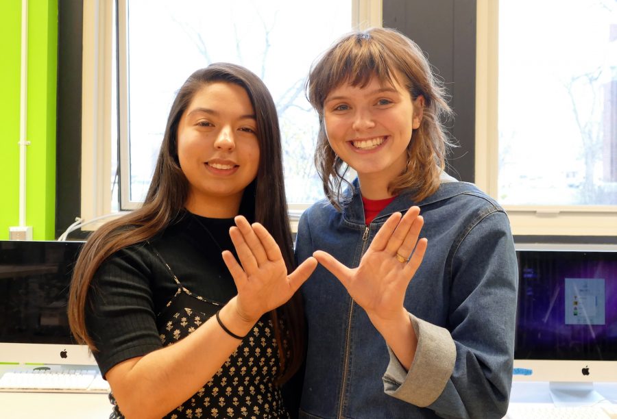 Sabrina Lopez and Grace Coudal, founders of Lane’s Organization of Womyn, showcase the W. 