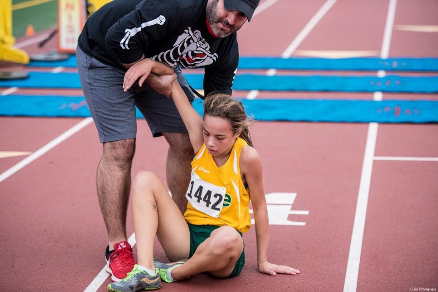 Sophomore Girls track runner Madeline King receives help after a race in the spring of 2016. High school athletes account for an estimated 2 million injuries, 500,000 doctor visits and 50,000 hospitalizations each year. 