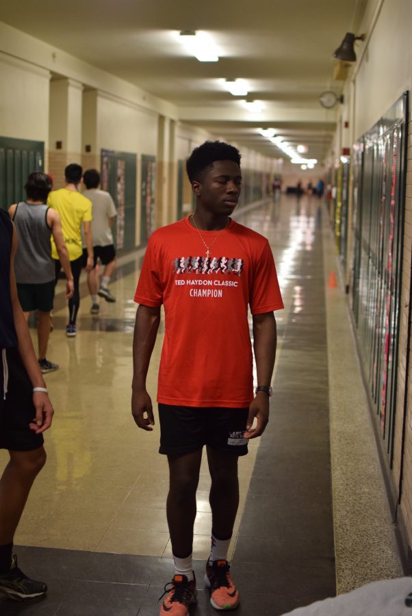 David Oluyadi practices sprints in the hallway during indoor season. 