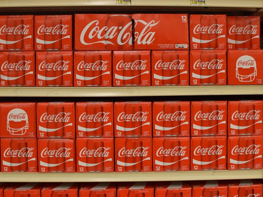 Rows of Coca-Cola 12 cases line the shelves of Jewel Osco. Coca Cola held a consolidated income of 7,366 million in 2015 according to the Coca Cola Company Reports. 
