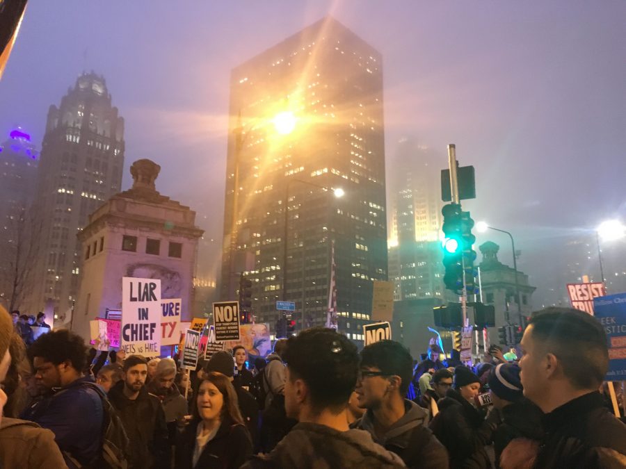 Protesters rally downtown Jan. 20 after the inauguration of president Trump. Many have protested Trumps views on Muslims and other marginalized groups. 
