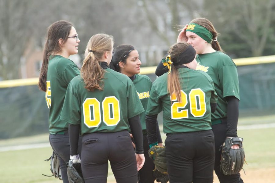 Team captains, Lauren Greif and Riley Mendoza, huddle with infielders, Katie Gallegos, Carolina Ayapan and Karli Spaid during a break in action. (Photo Courtesy of Lane Tech Softball)