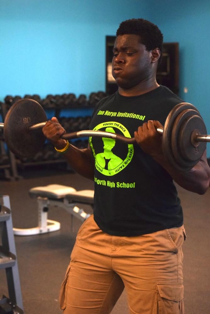Two-sport athlete Jeremiah Olojo lifts during the offseason to prepare for his upcoming college football season. Olojo will be playing football at Valparaiso University in Indiana. 