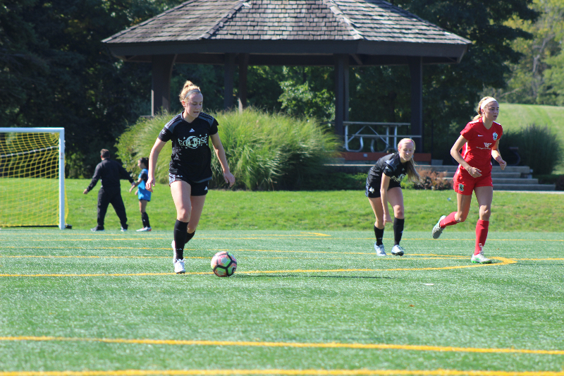 Monticello+taking+the+ball+up+while+playing+defense+for+her+club+team.+Monticello+has+been+playing+for+Eclipse%2C+a+nationally-ranked+soccer+club+based+in+Illinois%2C+for+six+years.+%28Photo+Courtesy+of+Maddie+Monticello%29