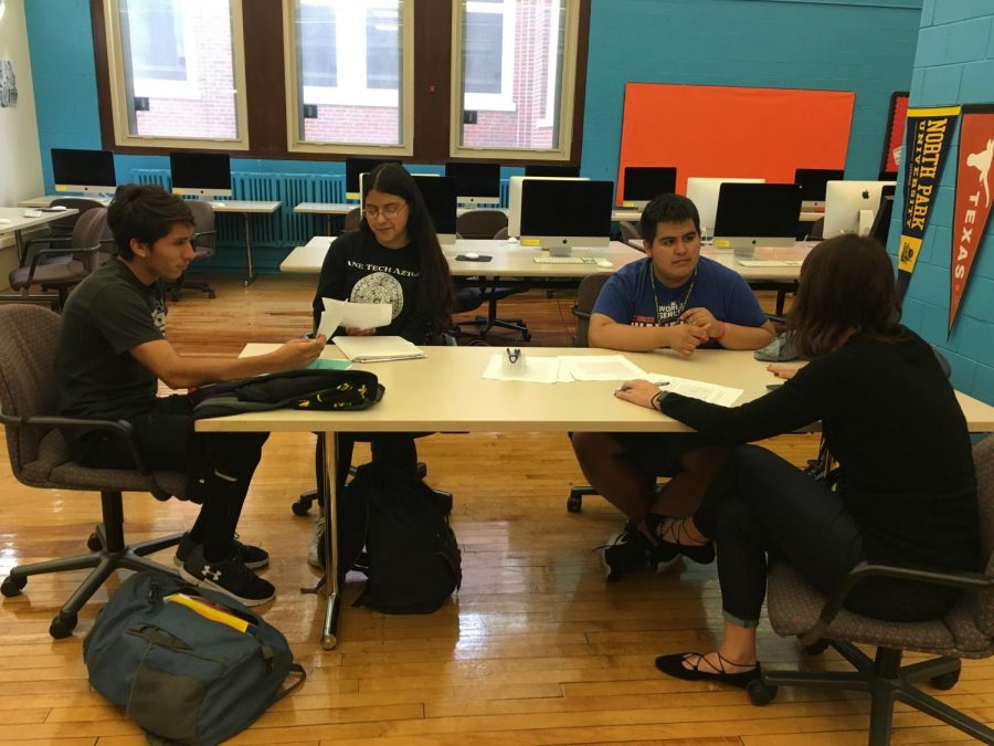  Three members of the First Generation Support Group editing each others college essays in the College and Career Center. Alberto Ramirez, far left, Liliana Tirado, left, Adrian Rivas, right, and Carqueville, far right.