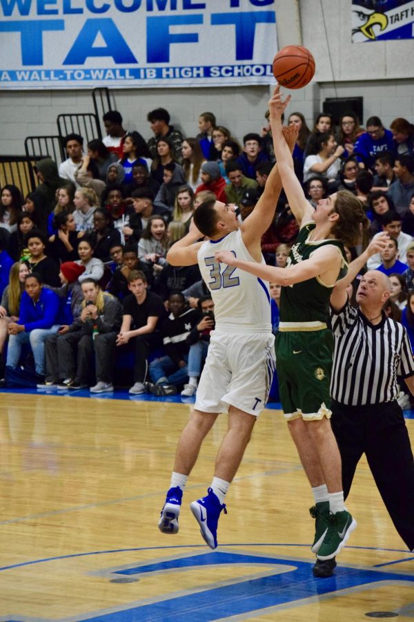 
Senior Calvin Keyes jumps at tipoff at the game against Taft on Dec. 8.
(Photo courtesy of Emma Loew)