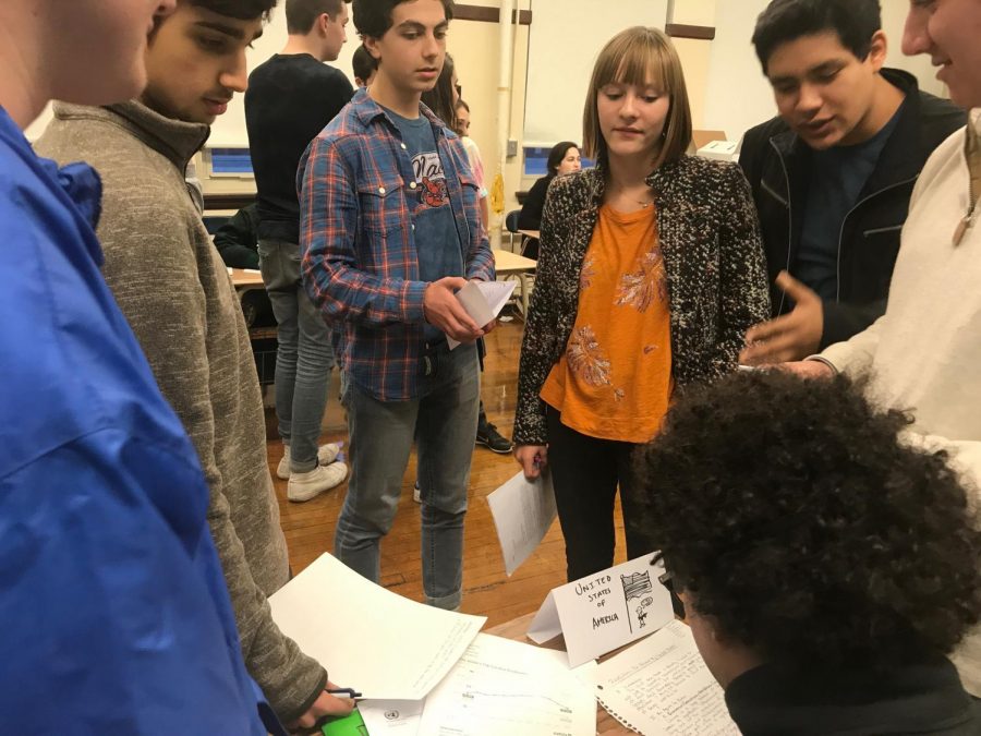 Model UN members, roleplaying as country delegates, write a resolution on the global drug trade during their meeting on Nov. 29 in preparation for their next conference on Jan. 27 at Francis Parker School.