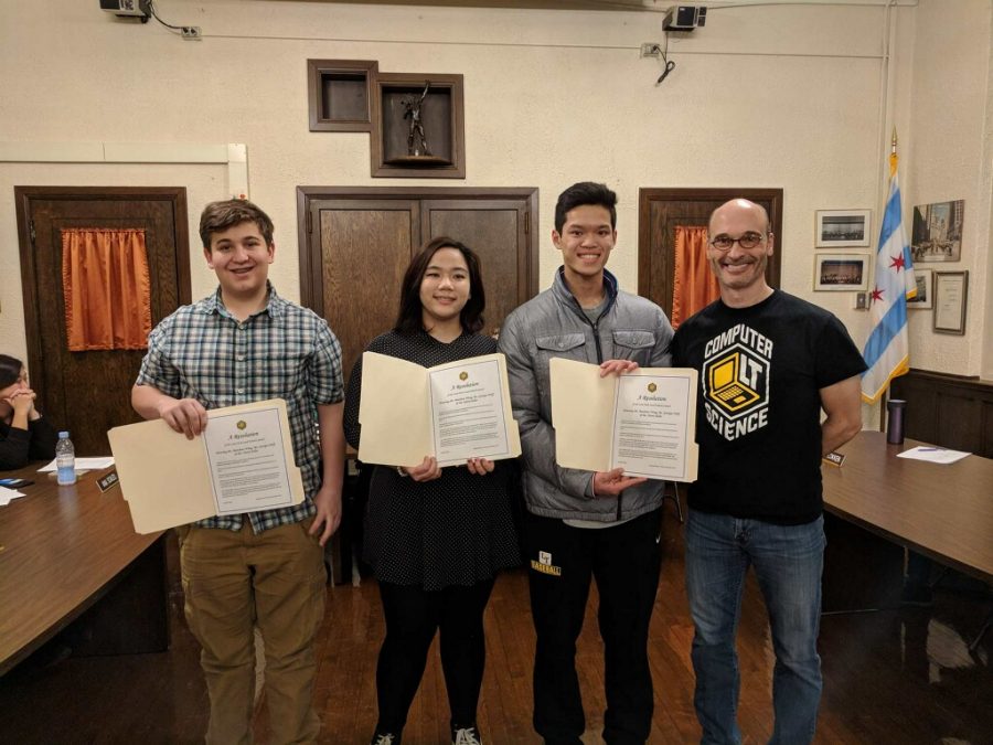 From left to right, students Harry Heller, Georgia Wolf and Matthew Wong pose alongside Principal Tennison for being recognized by the Illinois Chess Association for their achievements in chess. (Photo courtesy of Ben Wong)