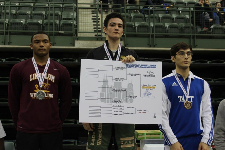 Steven Yee posing on the podium after winning first place in city at Chicago State University Jan. 21. (Photo courtesy of Gabriela Perez)