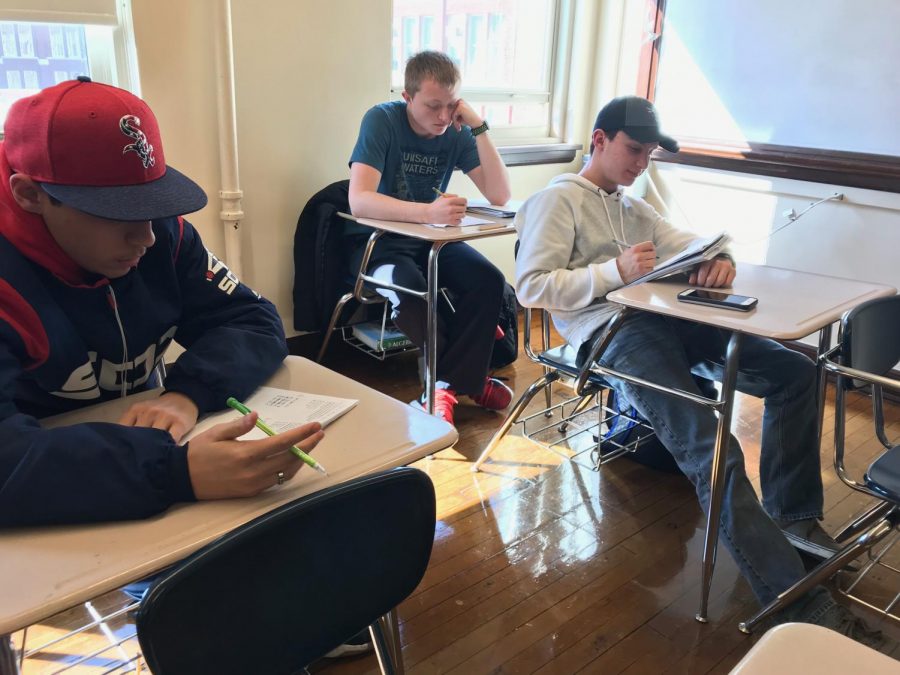 Students in Ms. Valerio’s SAT Prep Class work on their SAT math packets. 