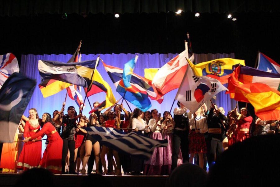 Members of I-Days clubs showcase their countrys flags at the conclusion of the I-Nights performance on March 16. (Photo courtesy of Vanessa Perez)