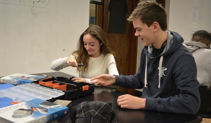 Ainslie Evans and Milo Lemoine work together in robotics class. Evans is the only girl in her group, and one out of only five girls in the class. 