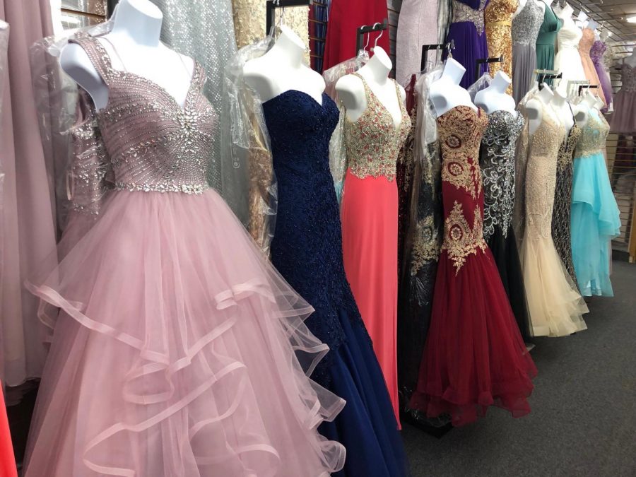 The rows of Fashion Elegance, located on Western Ave in the Lincoln Square neighborhood, are stocked with an assortment of dresses for students to pick from. (Photo courtesy of Eli Windy)