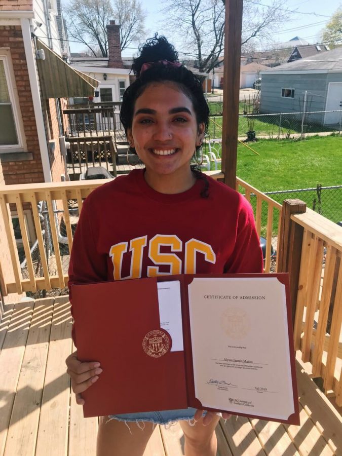 Alyssa Matias, who committed to USC in March, poses with her official letter of acceptance. 
Photo Courtesy of Alyssa Matias