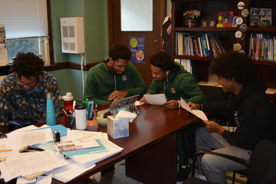From left, Aidan Lloyd, Cleveland Jones, Rashad Harries and Caleb Terefe in their independent study period going over plans for the documentary.    