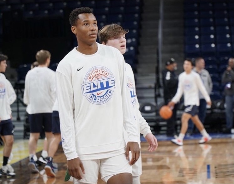 Varsity boys basketball players Chris McQueen and Sean Molloy warm up before the 2019 Chicago Elite Classic (Photo courtesy of Chris McQueen)