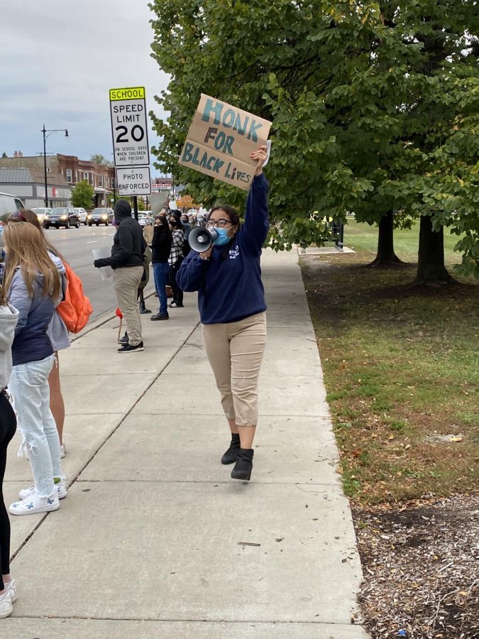 Dozens of Lane students gathered Tuesday night to show support and solidarity with the Black Lives Matter movement. The students lined the sidewalk of Western Ave., holding signs and chanting slogans, eliciting some honks in support from the passing cars. 