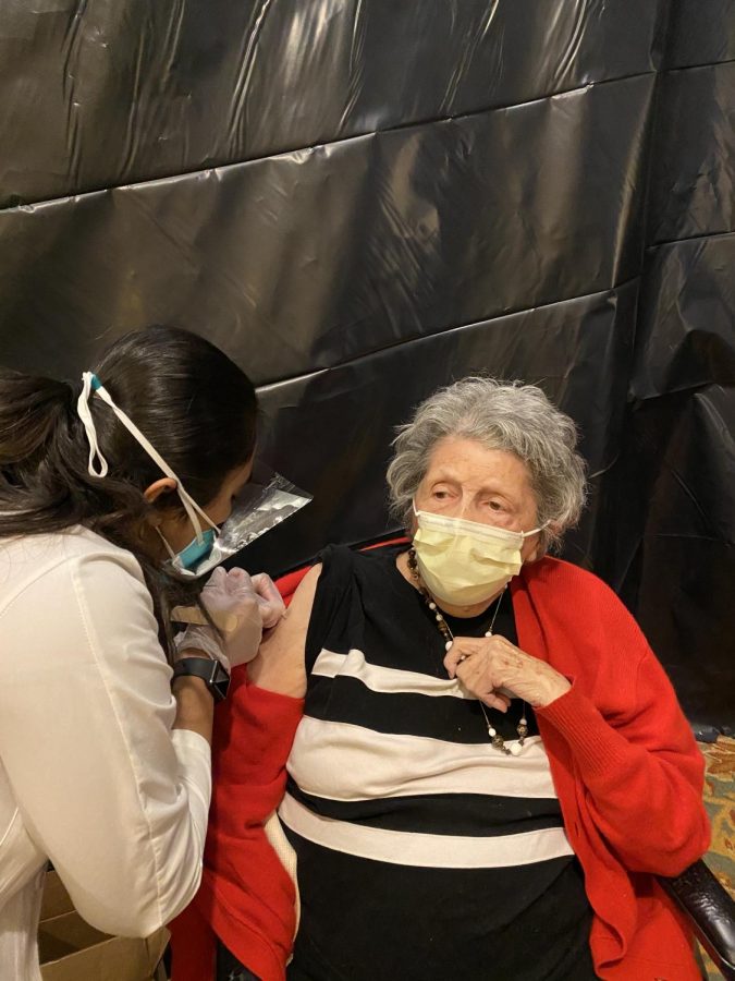 Woman receives COVID-19 vaccination as part of Chicago’s phase 1B vaccine distribution plan. (Photo courtesy of Maria Williams)