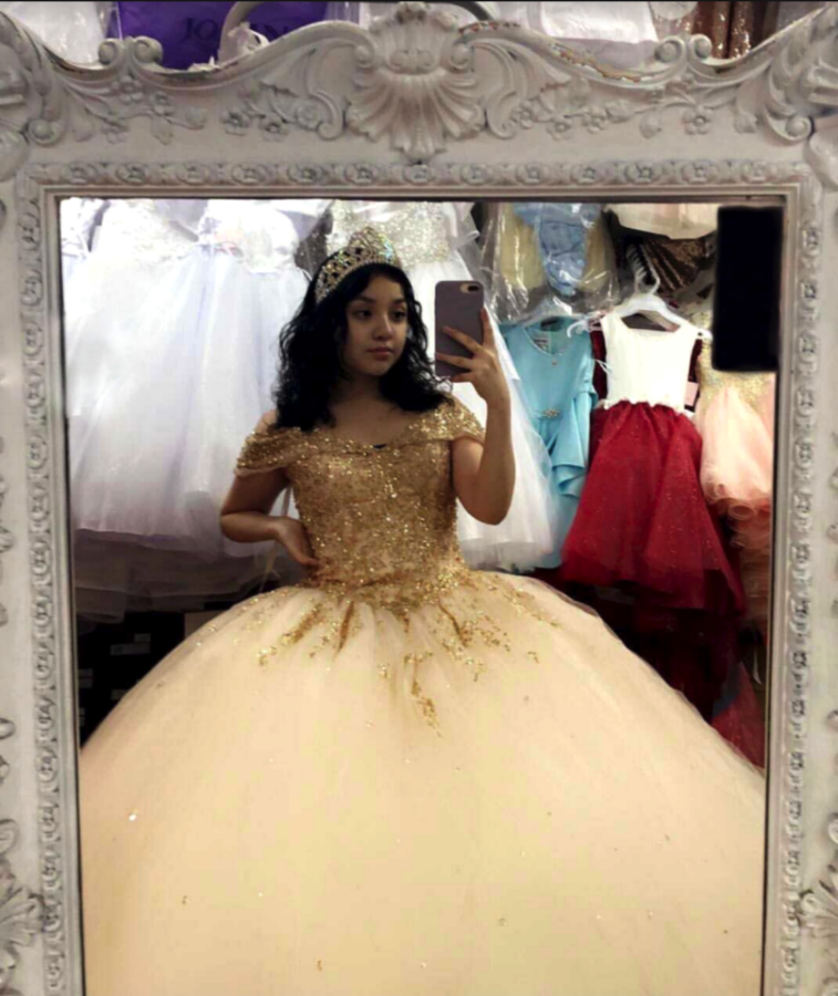 Ariana Medina tried on dresses before the cancellation of her quince in Caritas De Angel boutique, located on West Fullerton Ave in the Belmont Cragin neighborhood. (Photo courtesy of Ariana Medina)