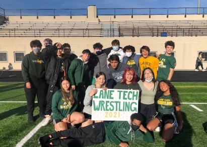 The Wrestling team poses for a photo at the homecoming pep rally this past September. (Photo courtesy of Noemi Marchan)