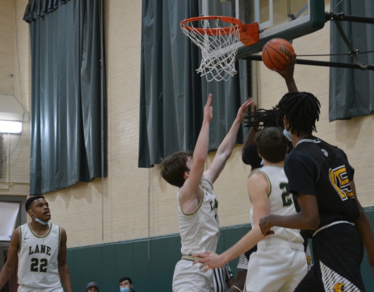 Lane’s Sean Molloy and Lucas Basille defend as a Clark defender attempts a basket. 