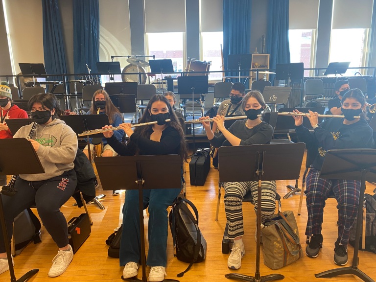 Band students practice using specialty masks on Dec. 13.