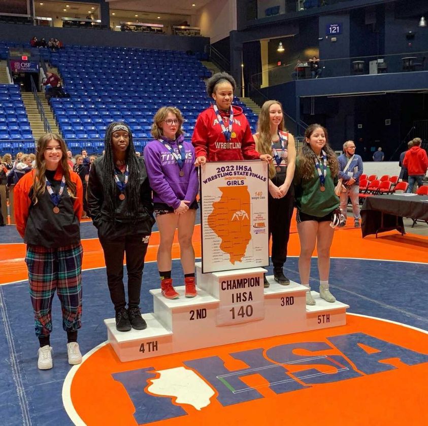 Noemi Marchan (far right) stands on the IHSA state podium. (Photo courtesy of Marchan)
