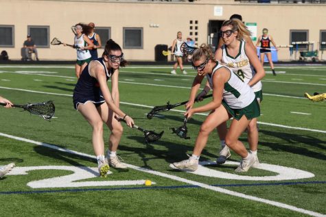  Lane and Payton players rush to gain possession of a ground ball.
