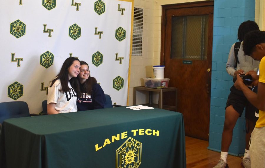Andrea Djuric (Left) and Madeline Lach (Right) being photographed at the College Signing Day for athletes on June 1.