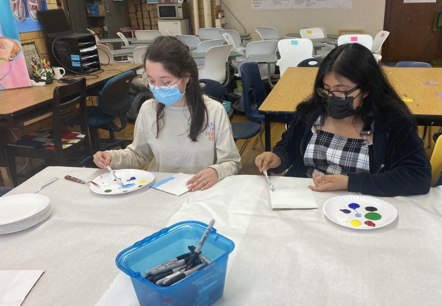 Students experimenting with pallette knife painitings.