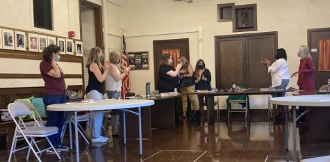 LSC members clap for outgoing LSC Chairperson Emily Haite, as she recieved a resolution for her time with the LSC at the June meeting.