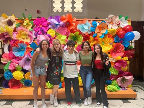 Students pose in front of the handmade flower display in front of the main office on Sept 16, Mexican Independence Day
