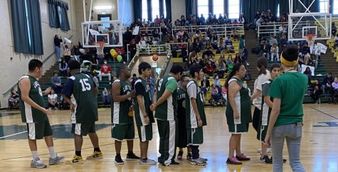 Cluster Program athletes line up in Gym 1 before their Special Olympics Basketball matchup against Ray Graham on Jan. 27. The game also featured dance, cheer and music performances.