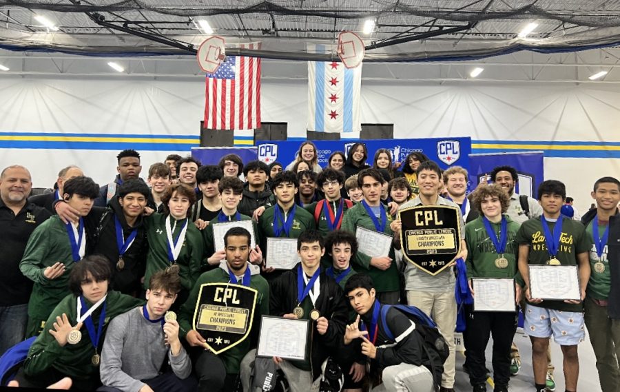 Lanes wrestling team with their city championship plaques after winning their second straight boys title. (Photo courtesy of Sylvia Zavala)