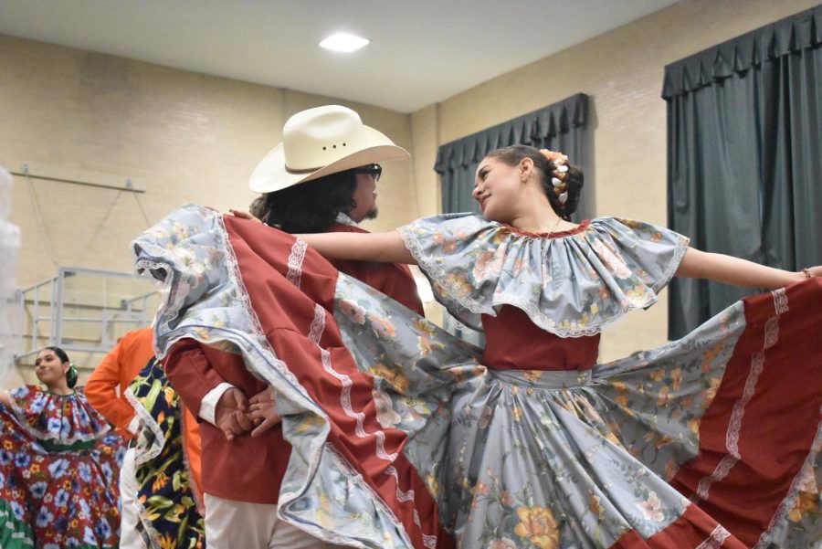 Seniors Lando Torres, left, and Jocelyn Ramirez of Aztlán Club, dance Ballet Folklórico. 
