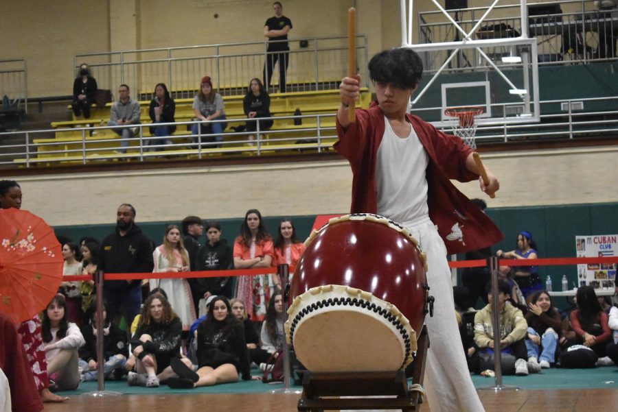 Sophomore and officer of Japanese Club David Geronimo plays a taiko drum during Japanese Club’s performance.