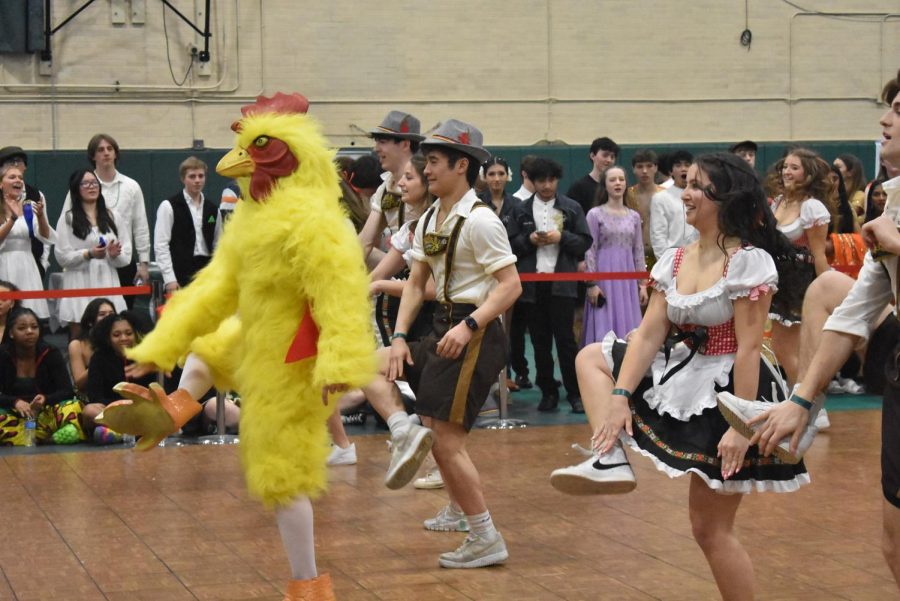 German Club dances with a chicken during I-Days.