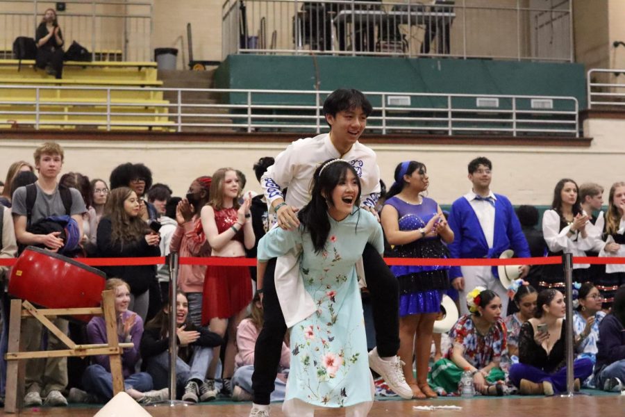 Freshman Trang Nguyen lifts up Junior Minh Vo at the end of Vietnamese Club’s performance.